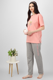 Sun-Kissed Dreams Pyjama Set . Women's nightwear featuring peach top with chest print that says - Beach More, Worry Less and plain grey pyajmas